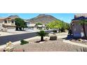 Scenic street view with mountain backdrop, showcasing the community's natural beauty at 6603 W Saddlehorn Rd, Phoenix, AZ 85083