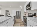 Clean kitchen design showcasing stainless steel appliances, white cabinets and countertops, and modern fixtures at 703 E Corte Oro --, Phoenix, AZ 85020
