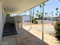 Covered porch area with steps, providing a comfortable transition from outdoor to indoor living at 7300 N 51St Ave # G102, Glendale, AZ 85301