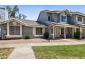 Inviting two-story house featuring a cozy front yard and well-kept landscaping at 860 N Mcqueen Rd # 1058, Chandler, AZ 85225