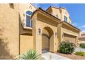 Inviting home exterior featuring a gated entry, lovely landscaping, and stylish architectural details at 1367 S Country Club Dr # 1320, Mesa, AZ 85210