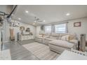 Inviting living room with a plush gray sofa, modern decor, and ample natural light at 156 N Hawes Rd # 68, Mesa, AZ 85207