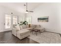 Bright living room with neutral tones, wood floors, and a comfortable sectional sofa at 16023 S 30Th Pl, Phoenix, AZ 85048