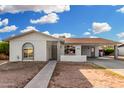 Charming single-story home featuring a covered carport and low-maintenance landscaping at 17616 N 20Th Dr, Phoenix, AZ 85023