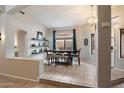 Bright dining room featuring decorative shelves, backyard views, and neutral tones at 20440 N 39Th Dr, Glendale, AZ 85308
