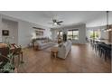 Bright open living room with tile floors and backyard pool view at 20585 W Garden St, Buckeye, AZ 85396