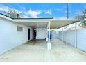 Spacious carport featuring covered parking with a storage area and brick perimeter wall at 2127 W San Miguel Ave, Phoenix, AZ 85015