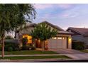 Home featuring a well-manicured front yard, stone accents, and a two-car garage at 3437 E Appaloosa Rd, Gilbert, AZ 85296