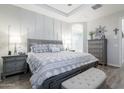 Serene main bedroom featuring a tray ceiling, neutral tones, and an en-suite bathroom entrance at 3437 E Appaloosa Rd, Gilbert, AZ 85296