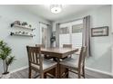 Cozy dining area with a wooden table and natural light from the windows at 3600 N Hayden Rd # 3405, Scottsdale, AZ 85251