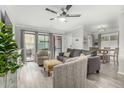 Open-concept living space with sliding glass doors and a comfortable seating arrangement at 3600 N Hayden Rd # 3405, Scottsdale, AZ 85251
