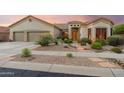 Charming single-story home with desert landscaping and a three-car garage at 4448 E Sleepy Ranch Rd, Cave Creek, AZ 85331