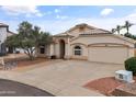 Well maintained single-story home with desert landscaping, paver walkway, and a two car garage at 662 S Saddle St, Gilbert, AZ 85233