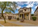 Inviting two-story home with a covered porch, neat landscaping, and charming curb appeal at 6907 S 8Th Dr, Phoenix, AZ 85041