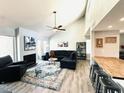 Stylish living room with modern decor, vaulted ceilings, and comfortable seating arrangement at 7409 N Via Camello Del Norte -- # 138, Scottsdale, AZ 85258