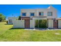 Inviting curb appeal with lush green lawn and a charming exterior featuring a private gated entrance at 7830 E Valley Vista Dr, Scottsdale, AZ 85250