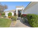 Charming home featuring a manicured walkway leading to the front entrance at 9265 N 115Th St, Scottsdale, AZ 85259