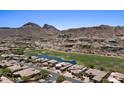 Expansive aerial view capturing the property's serene setting by the lush golf course and desert mountains at 9432 N Longfeather --, Fountain Hills, AZ 85268