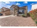 Attractive two-story house with a well-manicured yard and desert landscaping at 11132 W Mariposa Dr, Phoenix, AZ 85037