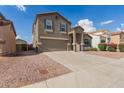 Beautiful two-story house with a two car garage and desert landscaping at 11132 W Mariposa Dr, Phoenix, AZ 85037