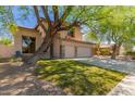 Charming two-story home with mature trees, well-kept lawn, and convenient three-car garage at 1453 E Elgin Pl, Chandler, AZ 85225