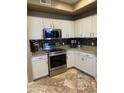 Updated kitchen showcasing stainless steel appliances, granite countertops, and neutral backsplash at 14575 W Mountain View Blvd # 711, Surprise, AZ 85374