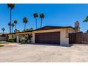 Single story home featuring an attached garage and a low maintenance landscaped yard at 1535 E Kenwood St, Mesa, AZ 85203