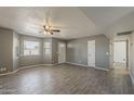 Spacious living room with new floors, neutral colors, and ample natural light at 15845 N 60Th Dr, Glendale, AZ 85306
