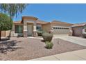 Charming single-story home with a well-manicured landscape, offering a warm and inviting curb appeal at 16874 W Tonbridge St, Surprise, AZ 85374