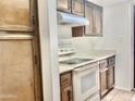 Functional kitchen featuring ample cabinetry, stove and oven combination and a bright, clean aesthetic at 1927 E Hampton Ave # 260, Mesa, AZ 85204