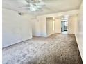 Spacious living room featuring neutral carpet and bright natural light. This room is ready for new memories at 1927 E Hampton Ave # 260, Mesa, AZ 85204