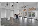 Bright, open living room featuring a stylish fireplace, stone floors, and abundant natural light at 1940 E Citation Ln, Tempe, AZ 85284