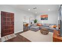 Inviting living room featuring a comfortable gray sectional sofa, area rug, and stylish decor at 2227 N 16Th Ave, Phoenix, AZ 85007