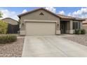 Inviting single-story home with a two-car garage, complemented by low-maintenance landscaping and a neutral color palette at 3067 E Merlot St, Gilbert, AZ 85298