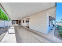 Spacious carport providing covered parking with direct access to the home's screened-in entrance at 3433 E Sandra Ter, Phoenix, AZ 85032