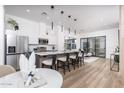 Bright, open kitchen with a large island, modern appliances, pendant lighting, and seamless flow to the living area at 4220 N 32Nd St # 31, Phoenix, AZ 85018