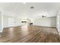 Expansive living room with beautiful vinyl floors, modern ceiling fans and abundant natural light at 428 E Kachina Trl, Phoenix, AZ 85042