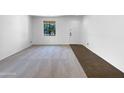 Bright room featuring a window and carpet, perfect for customization and comfort at 43530 W Eddie Way, Maricopa, AZ 85138