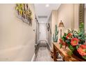 Tastefully decorated hallway entrance featuring flowers and rustic wooden table at 5350 E Deer Valley Dr # 3274, Phoenix, AZ 85054