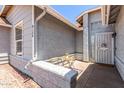 Inviting front patio featuring a seating area and security door, perfect for enjoying outdoor relaxation at 6156 W Del Rio St, Chandler, AZ 85226