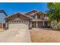 Charming two-story home featuring a desert landscape, a two-car garage and a neutral color palette at 634 W Aviary Way, Gilbert, AZ 85233