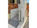 The home's deck features an installed accessibility lift for easy access at 8209 E 5Th Ave, Mesa, AZ 85208