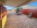 The brick-paved back patio offers a shaded area perfect for outdoor seating and entertaining at 8209 E 5Th Ave, Mesa, AZ 85208