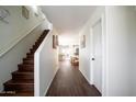 Inviting entryway with hardwood floors and staircase leading to the upper level at 8516 N 64Th Ave, Glendale, AZ 85302