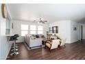 Bright living room with hardwood floors, neutral tones, and comfortable seating at 8516 N 64Th Ave, Glendale, AZ 85302