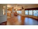 Spacious open-concept living and dining area with hardwood floors at 8600 E Broadway Rd # 88, Mesa, AZ 85208