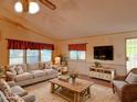 Cozy living room with floral accents, plush seating, and natural light at 8600 E Broadway Rd # 88, Mesa, AZ 85208