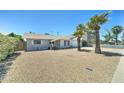 Single story home with a two car garage and low maintenance rock landscaping at 907 E Broadmor Dr, Tempe, AZ 85282
