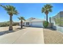 Single story home featuring a two car garage and low maintenance landscaping at 907 E Broadmor Dr, Tempe, AZ 85282