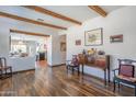 Open-concept living room with exposed beam ceilings and seamless flow to the kitchen at 9816 E Stone Circle E Ln, Gold Canyon, AZ 85118